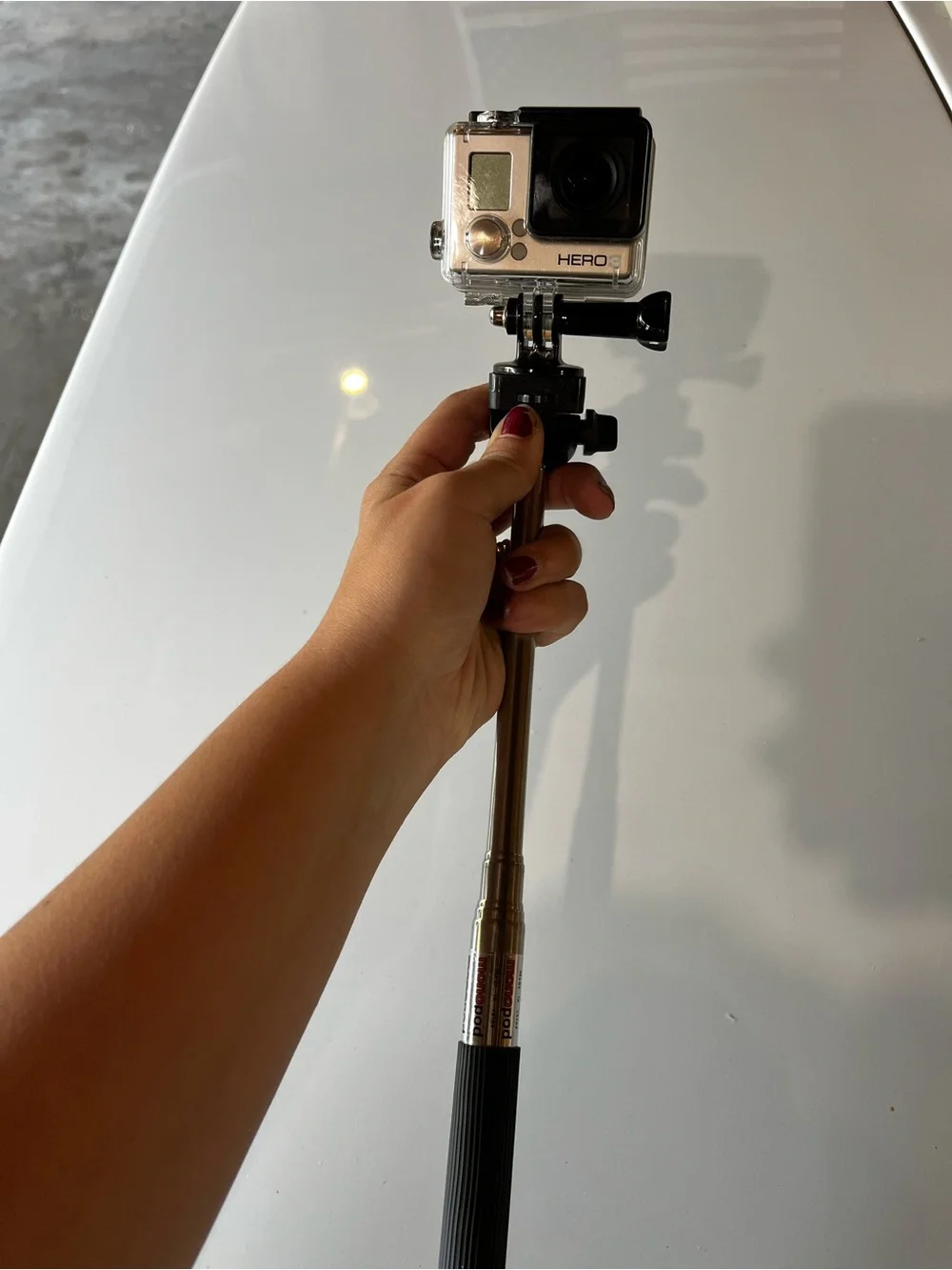 GoPro HERO 3 with Yellow Floating Hand Grip and Black/White Flexible Tripod